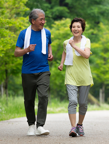 Two seniors walking happily